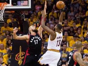 Jonas Valanciunas of the Toronto Raptors tries to block Tristan Thompson of the Cleveland Cavaliers during the first half of Game 1 at Quicken Loans Arena on May 1, 2017. (Jason Miller/Getty Images)