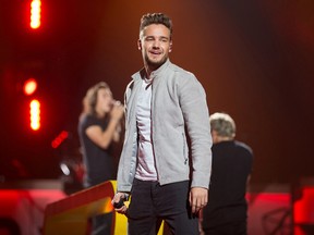 Liam Payne smiles at the crowd as One Direction takes to the stage at the Canadian Tire Centre in Ottawa in 2015. (Wayne Cuddington/Postmedia Network/Files)