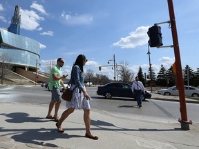Pedestrians walk near The Forks on Tues., May 2, 2017. The Forks Renewal Corporation intends to reduce Israel Asper Way from four lanes to two south of York Avenue in an effort to make the area more pedestrian-friendly. Kevin King/Winnipeg Sun/Postmedia Network
