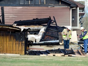 In this April 18, 2017, photo, workers are seen near a house that was destroyed in a deadly explosion in Firestone, Colo., on April 17. (Matthew Jonas/The Daily Times Call via AP)