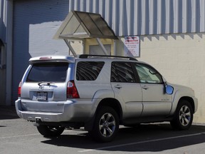 In this March 3, 2017, file, photo, the Toyota 4Runner held in a Boston Police evidence lot in the Hyde Park neighborhood of Boston is seen during a "view" of pertinent locations and evidence in the Aaron Hernandez trial. (John Wilcox/The Boston Herald via AP, Pool, File)