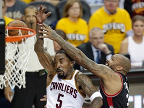 Raptors’ P.J. Tucker (right) said they have to defend the Cavs without fouling them. (AP)