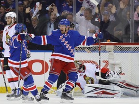 Rangers’ Michael Grabner celebrates his goal that was the result of a puck mishandled by Senators goalie Craig Anderson in Game 3 last night in New York. The goal turned out to be the game-winner in the Rangers’ 4-1 victory. (GETTY IMAGES)