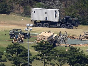 In this April 27, 2017, file photo, U.S. Army soldiers install the missile defense system called Terminal High-Altitude Area Defense at a golf course in Seongju, South Korea. (Shon Hyung-joo/Yonhap via AP, File)