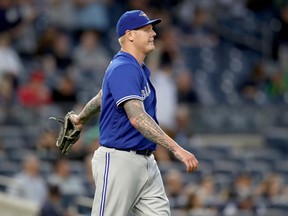 Mat Latos #57 of the Toronto Blue Jays reacts after giving up back to back home runs in the second inning against the New York Yankees on May 2, 2017 at Yankee Stadium in the Bronx borough of New York City. (Elsa/Getty Images)