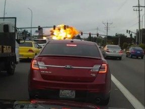 A dashcam video shows a plane burst into flames before crashing on a street in Washington State. (Screengrab)