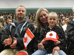 From left, Andrew Kraft, 10, Matt Kraft, Marina Kraft and Piper Kraft, 8, were in the front row of a citizenship ceremony held Wednesday May 3, 2017 in the gym at St. Patrick's Catholic High school in Sarnia, Ont. The Kraft family of Port Franks were there to watch as Marina, who was born in Holland, took her oath of citizenship. (Paul Morden/Sarnia Observer)