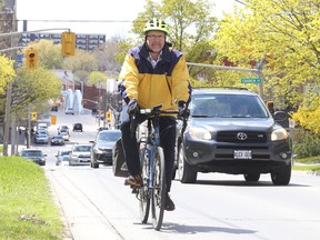 Jason Miller/The Intelligencer
Coun.  Egerton Boyce cycles along Bridge Street East, near Church Street, where the city plans to start designated bike lanes.