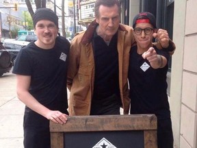 Liam Neeson poses with staff at Big Star Sandwiches in New Westminster.(Instagram)