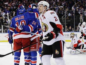 Ottawa Senators' Dion Phaneuf skates past as the New York Rangers celebrate a goal by Oscar Lindberg against goalie Craig Anderson during Game 3 on May 2, 2017. (AP Photo/Frank Franklin II)