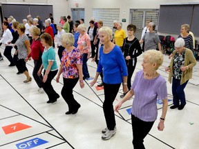 Seniors take part in a line dancing class at the Kiwanis Senior's Centre on Wednesday. (MORRIS LAMONT, The London Free Press)