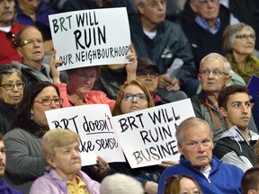 Londoners with signs at the public input meeting for the BRT at Budweiser Gardens on (Free Press file photo)