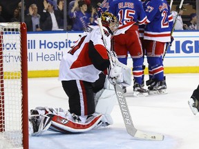 Goalie Craig Anderson kneels down in his crease during the Senators’ 4-1 loss to New York in Game 3 of their series. (Getty Images)