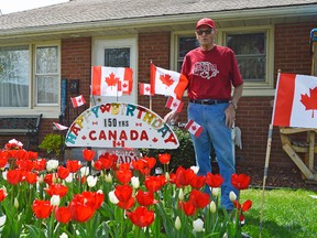 Bob Wheeler planted 150 red and while tulips in his front yard last fall in celebration of Canada's 150th year. Wheeler has turned gardening into a full time hobby since he retired in 1995.