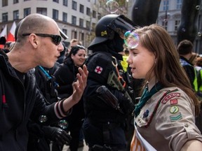 A Czech Girl Scout has become an Internet sensation after a photo showing her confronting a neo-Nazi group during a rally went viral. (Vladimir Cicmanec/Facebook)