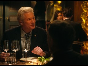 This image released by The Orchard shows Richard Gere, left, and Rebecca Hall in a scene from "The Dinner." (The Orchard via AP)