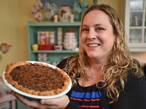 Karlynn Johnston, author of the cookbook Flapper Pie and Blue Prairie Sky, holds a Saskatoon Butter Tart Pie in Edmonton on Oct. 14, 2016. (Ed Kaiser/Postmedia Network)