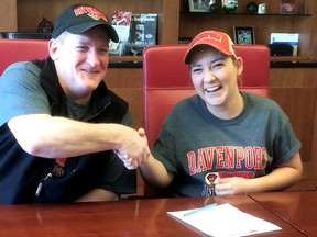 Hockey player Sydney Caron, right, of Sarnia smiles with Davenport Panthers head coach Kurt Carter after signing with Davenport University. (Contributed Photo)