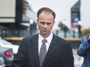 Toronto Police Sgt. Christopher Heard, charged with two counts of sexual assault, leaves a Toronto court on Thursday, May 4, 2017. (ERNEST DOROSZUK/TORONTO SUN)