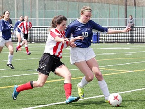 Macdonald-Cartier's Ariane Saumure, left, battles for the ball with Marymount's Hope Joly during open premier girls soccer action at James Jerome Sports Complex in Sudbury, Ont. on Thursday, May 4, 2017. Gino Donato/The Sudbury Star/Postmedia Network