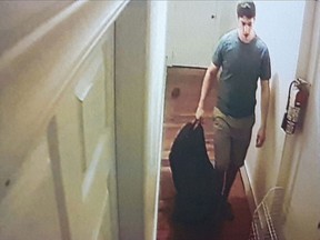 This still photo shot off surveillance tapes seized from William Sandeson's apartment shows the last known moments of Taylor Samson's life, released in court, Thursday, May 4, 2017. THE CANADIAN PRESS/Kieran Leavitt