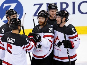 Team Canada forward Claude Giroux celebrates his goal with teammates during an exhibition game against Switzerland at the ice stadium Les Vernets, in Geneva on May 2, 2017. (Salvatore Di Nolfi/Keystone via AP)