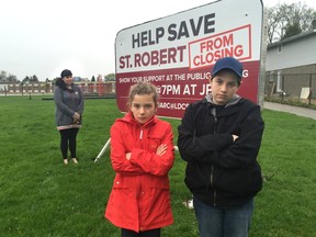 Amanda Raposo and her children, Ava, who?s in Grade 5, and Austin, who?s in Grade 8, are trying to stop the closing of St. Robert elementary school in London. (Derek Ruttan/The London Free Press)