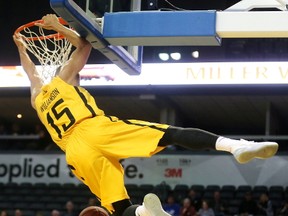 Garrett Williamson of the Lightning throws down a monster dunk over the absent Orangeville A?s defence during the first half of Game 1 of their National Basketball League of Canada Central semifinal at Budweiser Gardens on Thursday night. The Lightning led 68-28 at the half and won 117-87. (Mike Hensen/The London Free Press)