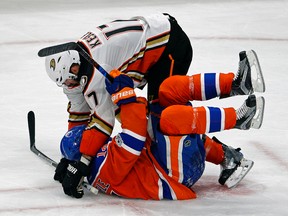 Edmonton Oilers forward Jordan Eberle (bottom) is checked by Anaheim Ducks centre Ryan Kesler during the fourth game of their playoff series in Edmonton on Wednesday, May 3, 2017. The Ducks defeated the Oilers in overtime by a score of 4-3 to tie the series 2-2. (Larry Wong)