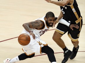 Cleveland Cavaliers' Kyrie Irving drives against Toronto Raptors' Cory Joseph during the second half of Game 2 on May 3, 2017. (AP Photo/Tony Dejak)