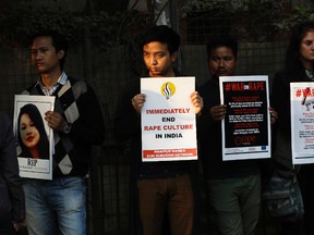 In this Feb. 21, 2017, file photo, Indians hold placards during a protest against an alleged rape in New Delhi, India. India's top court on Friday, May 8, 2017 upheld death sentences of four men who were convicted in the fatal gang-rape and torture of a 23-year-old medical student on a moving bus in the Indian capital nearly five years ago. The four had challenged a 2013 trial court ruling that they should be hanged, which was later upheld by an appeals court. (AP Photo/Tsering Topgyal, file)