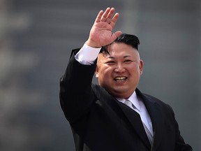 In this Saturday, April 15, 2017, file photo, North Korean leader Kim Jong Un waves during a military parade in Pyongyang, North Korea, to celebrate the 105th birth anniversary of Kim Il Sung, the country's late founder and grandfather of current ruler Kim Jong Un. North Korea has accused the U.S. and South Korean spy agencies of an unsuccessful assassination attempt on leader Kim Jong Un involving bio-chemical weapons. (AP Photo/Wong Maye-E, File)
