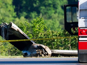 Part of a cargo plane lays on the ground following a fatal crash at Yeager Airport in Charleston, W. Va., Friday, May 5, 2017. The plane contracted by UPS went off the runway and over a hillside at the West Virginia airport Friday morning, an airport official said. (AP Photo/Ben Queen)