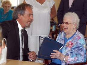 David Gough/Courier Press/DGough@postmedia.com
Chatham-Kent mayor Randy Hope presents a certificate to Dresden's Thelma Jacques during a celebration held at Dresden's Park Street Place on Wednesday, April 26. Jacques will turn 100 years-old next week.