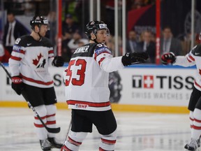 Canada's Mike Matheson (left), Jeff Skinner (centre), and Nate Mackinnon (right) celebrate a goal during the world hockey championship against the Czech Republic in Paris, France, on Friday, May 5, 2017. (Petr David Josek/AP Photo)