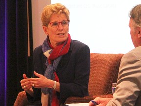 Ontario Premier Kathleen Wynne speaks with Graham Henderson, chairperson of the Ontario Chamber of Commerce, at the chamber's annual general meeting in Sarnia-Lambton Friday. Wynne touched on trade in her remarks at the Point Edward Holiday Inn. (Tyler Kula/Sarnia Observer)
