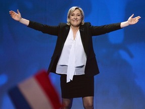This file photo taken on Feb. 26, 2017 at the Zenith de Nantes venue in Saint-Herblain shows French far-right Front National (FN) party candidate for the presidential election Marine Le Pen waving as she arrives to speak on stage during a campaign rally. (JEAN-FRANCOIS MONIER/AFP/Getty Images)