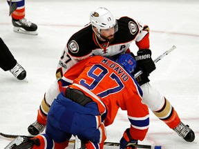 Edmonton Oiler Connor McDavid (bottom) is checked by Anaheim Ducks Ryan Kesler during the fourth game of their Stanley Cup playoff series in Edmonton on Wednesday May 3, 2017. The Ducks defeated the Oilers in overtime by a score of 4-3 to tie the series 2-2.