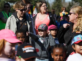 Grade 1 students watch from the crowd during Arbor Day festivities at Gold Bar Park in Edmonton on Friday, May 5, 2017. Ian Kucerak / Postmedia