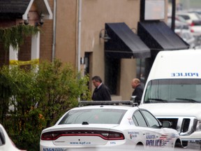 Kingston Police on the scene of a sudden death investigation at 75 Queen St. in Kingston, Ont. on Friday May 5, 2017. Steph Crosier/Kingston Whig-Standard/Postmedia Network