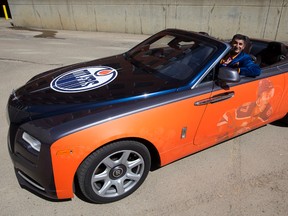 Ashif Mawji poses for a photo with his $350,000 Rolls Royce Dawn convertible with a Connor McDavid wrap on the side, in Edmonton Friday May 5, 2017. Photo by David Bloom