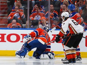 Anaheim Ducks' Jakob Silfverberg, centre, from Sweden, celebrates his game winning goal as Edmonton Oilers goalie Cam Talbot, right, picks himself up during overtime NHL hockey round two playoff action in Edmonton, Wednesday, May 3, 2017.