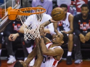 Raptors’ DeMar DeRozan goes hard to the hoop against the Cavaliers’ Channing Frye last night. (Ernest Doroszuk/Toronto Sun)