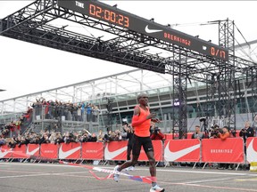 Olympic marathon champion Eliud Kipchoge crosses the finish line of a marathon race at the Monza Formula One racetrack, Italy, Saturday, May 6, 2017.  (AP Photo/Luca Bruno)