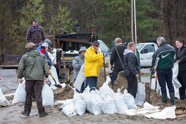 Volunteers fill sandbags at the Constance Bay Community Centre as the residents of Constance Bay deal with the Ottawa River rising to record levels and  flooding the region.  Wayne Cuddington/Postmedia