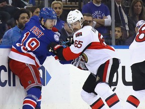 Jesper Fast of the New York Rangers battles with Erik Karlsson of the Ottawa Senators during the first period in Game 4 of the Eastern Conference Second Round during the 2017 NHL Stanley Cup Playoffs at Madison Square Garden on May 4, 2017 in New York City.  (Bruce Bennett/Getty Images)