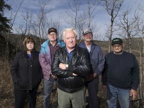 Bruce Tegart, centre, and neighbours, Arlene Heitzman, Norm Heitzman, Norman Ohrn and Wayne Sereda are pushing back against a proposed high-end gun range located 250 yards from Bruce's  home, proposed by Kloovenburg Sports Ltd. (Greg Southam/Edmonton Sun)
