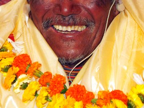 In this May 31, 2008 file photo, Min Bahadur Sherchan, who became the oldest person to climb Mount Everest on May 25, 2008, smiles upon his arrival in Katmandu, Nepal. (AP Photo/Binod Joshi, File)