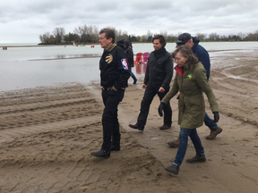 Mayor John Tory, Councillor Mary-Margaret McMahon and city staff toured a washed out Woodbine Beach on Saturday, May 6, 2017. The beach is so badly drenched from recent flooding that alternative plans may be necessary for the annual Victoria Day fireworks display. (Shawn Jeffords/Toronto Sun)