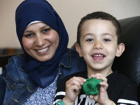 Abeer Salim and son Mohamed, 4, take part in the Nanny Angel Network where volunteers help mothers who have cancer withe child care on Friday May 5, 2017. (Michael Peake/Toronto Sun)